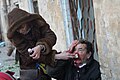 A woman performing first medical aid to a wounded protester. Clashes in Kyiv, Ukraine. Events of February 18, 2014