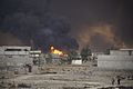 Cityscape of Qayyarah town on fire.The Mosul District, Northern Iraq, Western Asia. 09 November, 2016.
