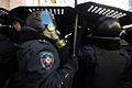 Line of internal troop solldiers holding protective positions. Signs say- Stop Barrocades! Stop Crackdown!. Clashes in Ukraine, Kyiv. Events of February 18, 2014-3