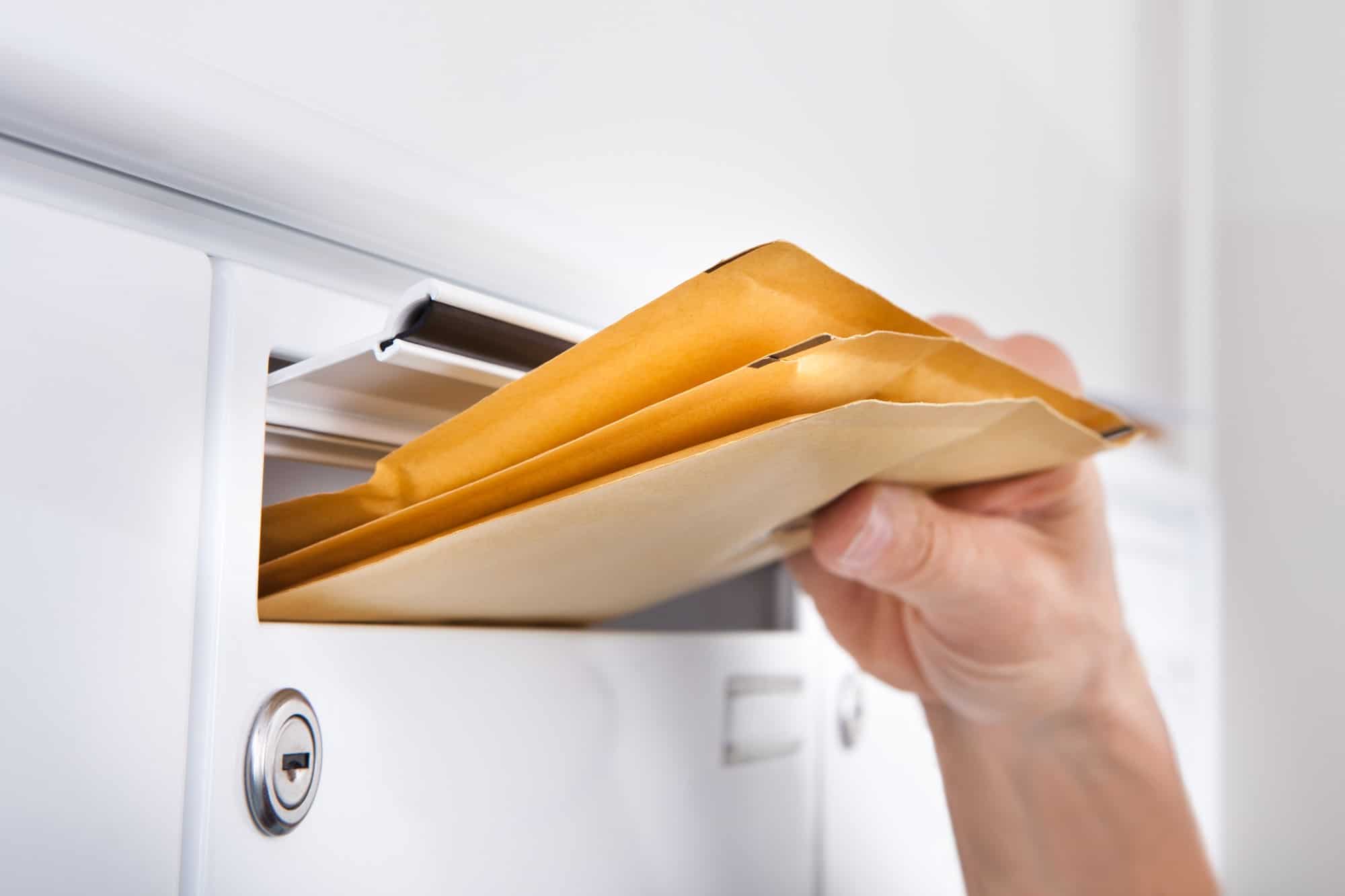 Letters being put into mailbox