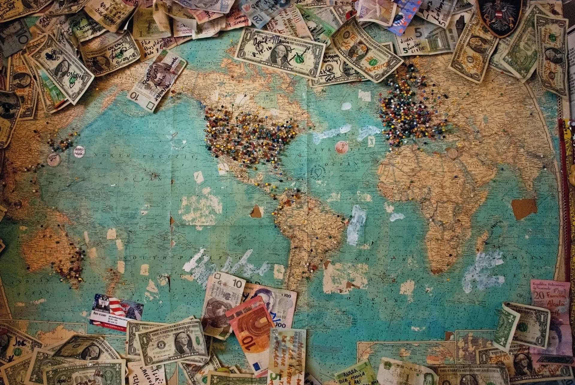 Map with pins and banknotes