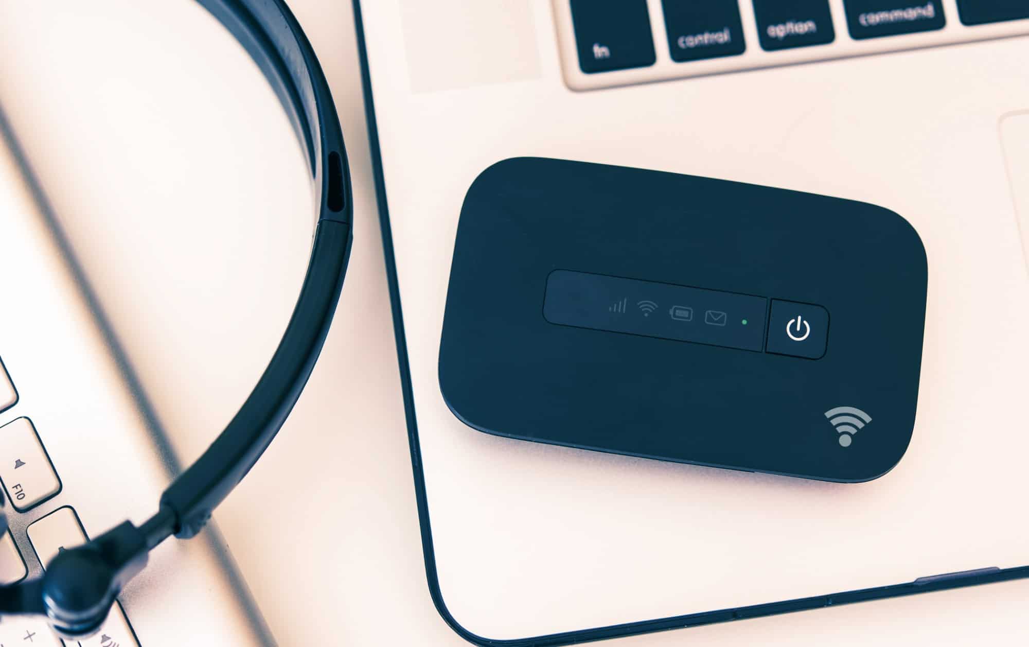 Mobile hotspot with laptop, keyboard, and headphones