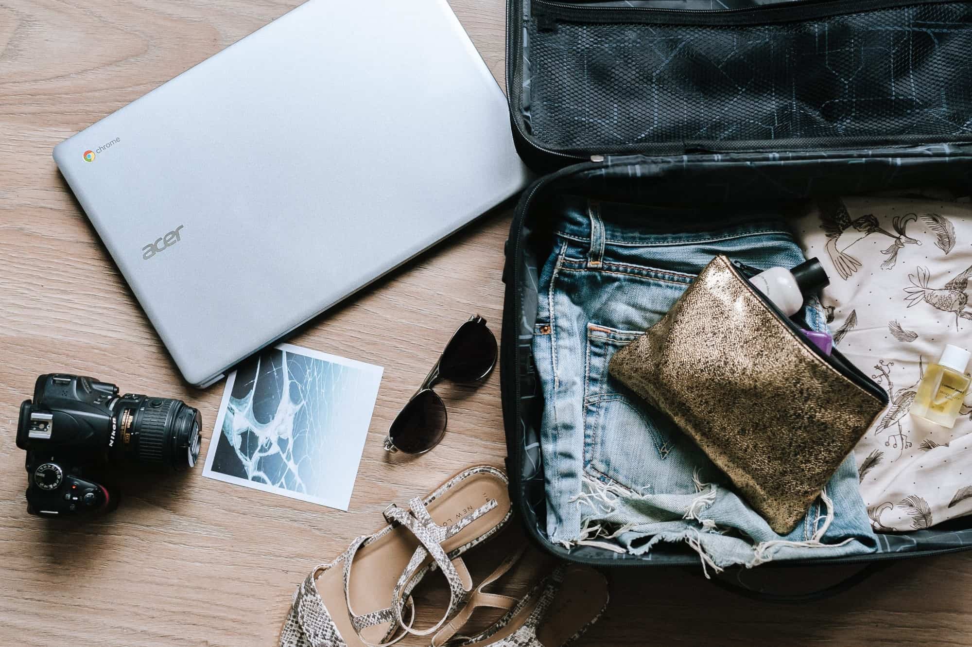 Suitcase with laptop and camera